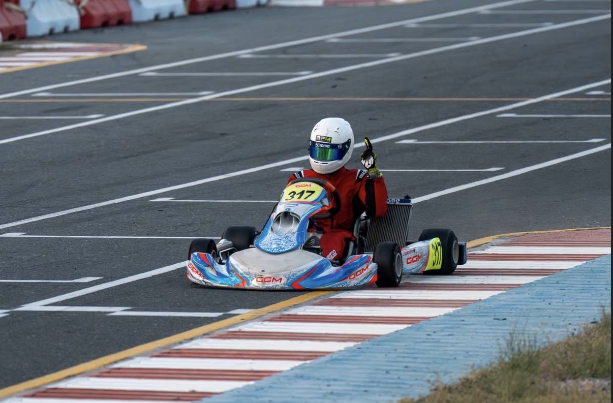 Amani Kinyua racing kart 317 on track