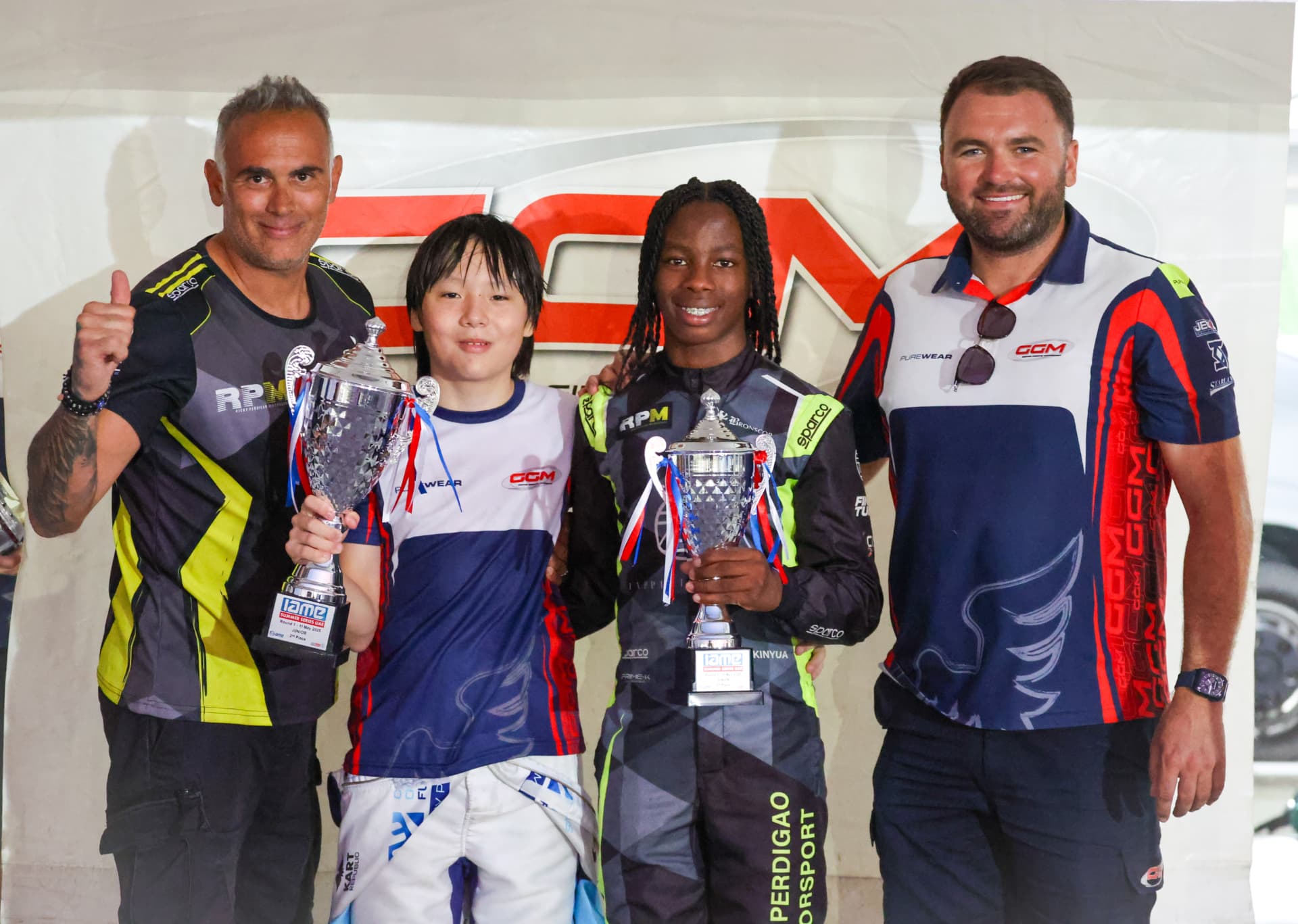Amani on the IAME Series UAE podium with his team